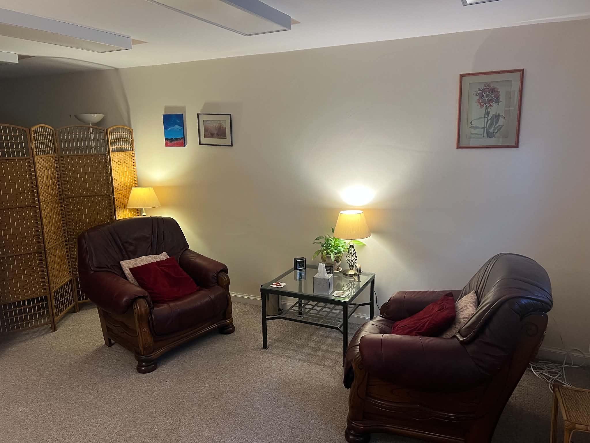 Two comfortable armchairs in the Edinburgh therapy room