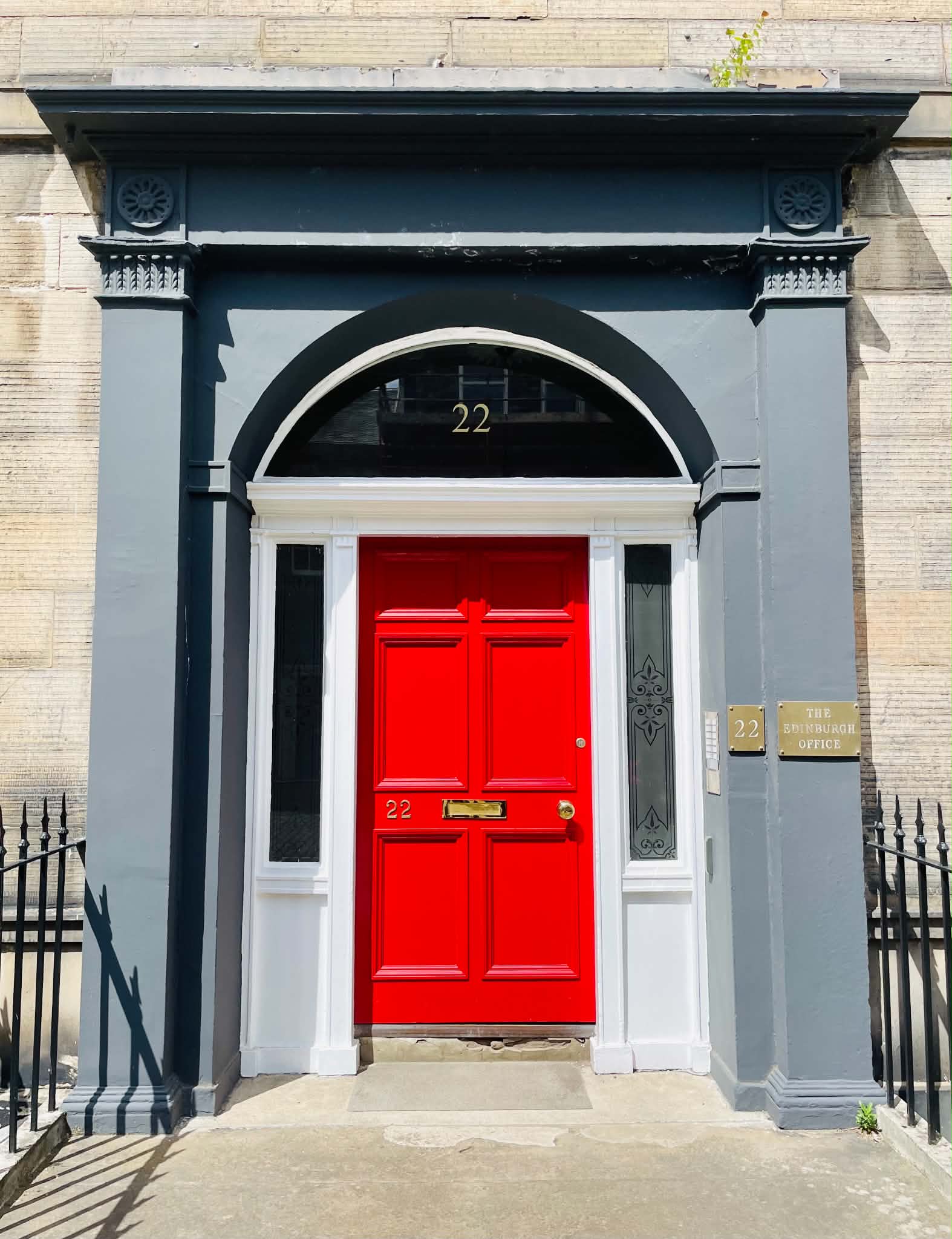 Red entrance door at 22 Forth Street, Edinburgh